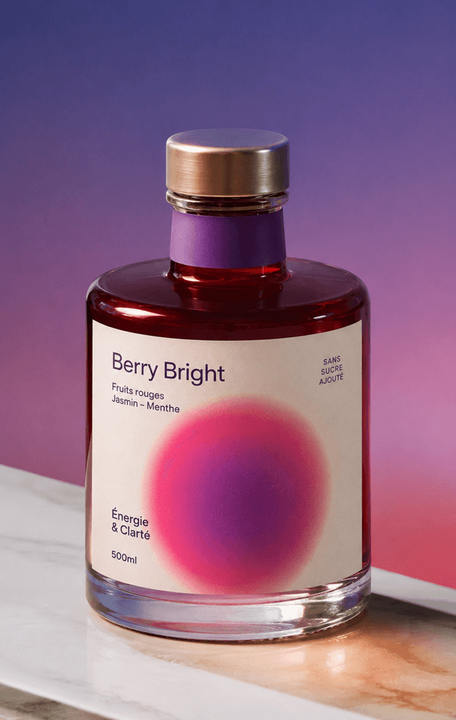 Product shot of a berry tonic bottle on a violet gradient backdrop